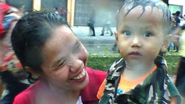 Mother and Child at the Thingyan Water Festival in Mandalay - Myanmar