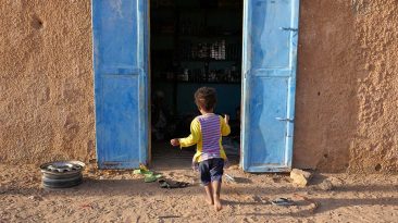Girl Running into House in Atar - Mauritania