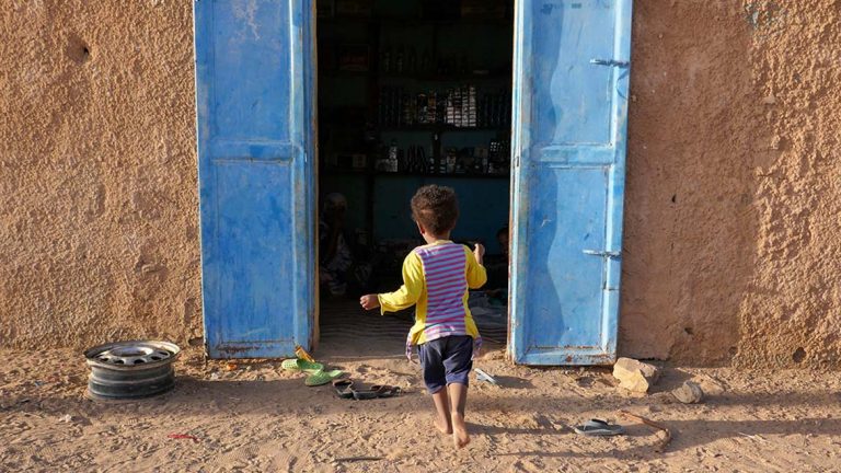 Girl Running into House in Atar - Mauritania
