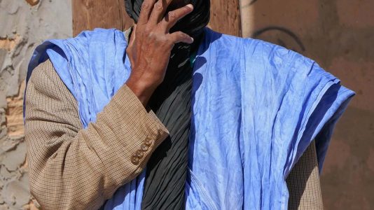 Man With Black Turban Smoking Cigarette for Portrait in Atar - Mauritania
