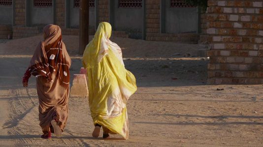 Two Muslim Women Walking into Town in Atar - Mauritania