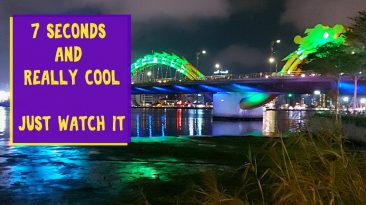 Night Time Hyperlapse of Color Changing Dragon Bridge and Tour Boats in Da Nang, Vietnam